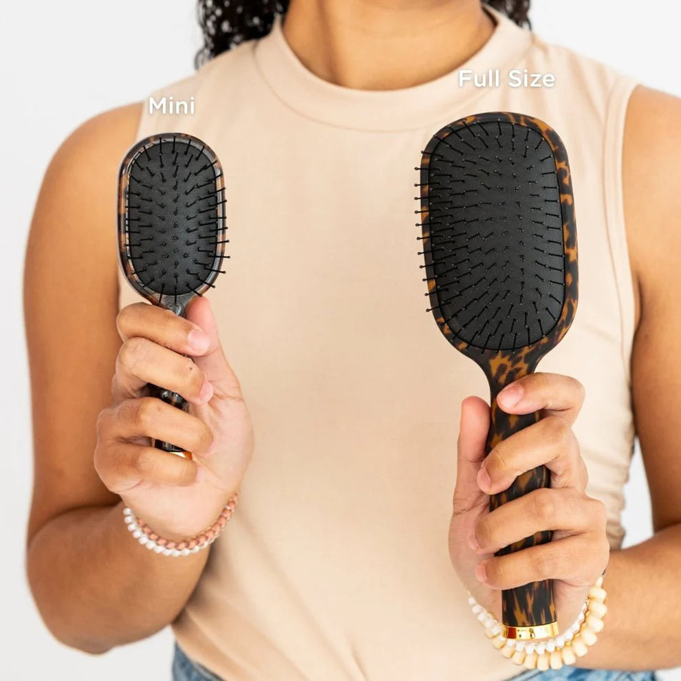Mini Detangler Brush for Medium Hair | Tortoise with black bristles; available in mini and full sizes.