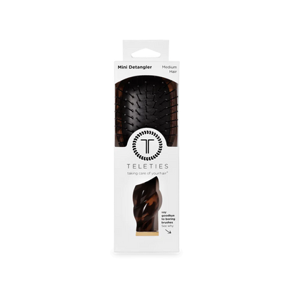 Mini Detangler Brush for Medium Hair | Tortoise, travel size, black base, brown accents, in clear-window white packaging.