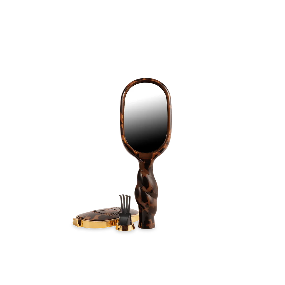 The Mini Detangler Brush for Medium Hair | Tortoise, compact size, with tortoiseshell pattern. Available in mini size.