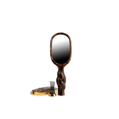 The Mini Detangler Brush for Medium Hair | Tortoise, compact size, with tortoiseshell pattern. Available in mini size.