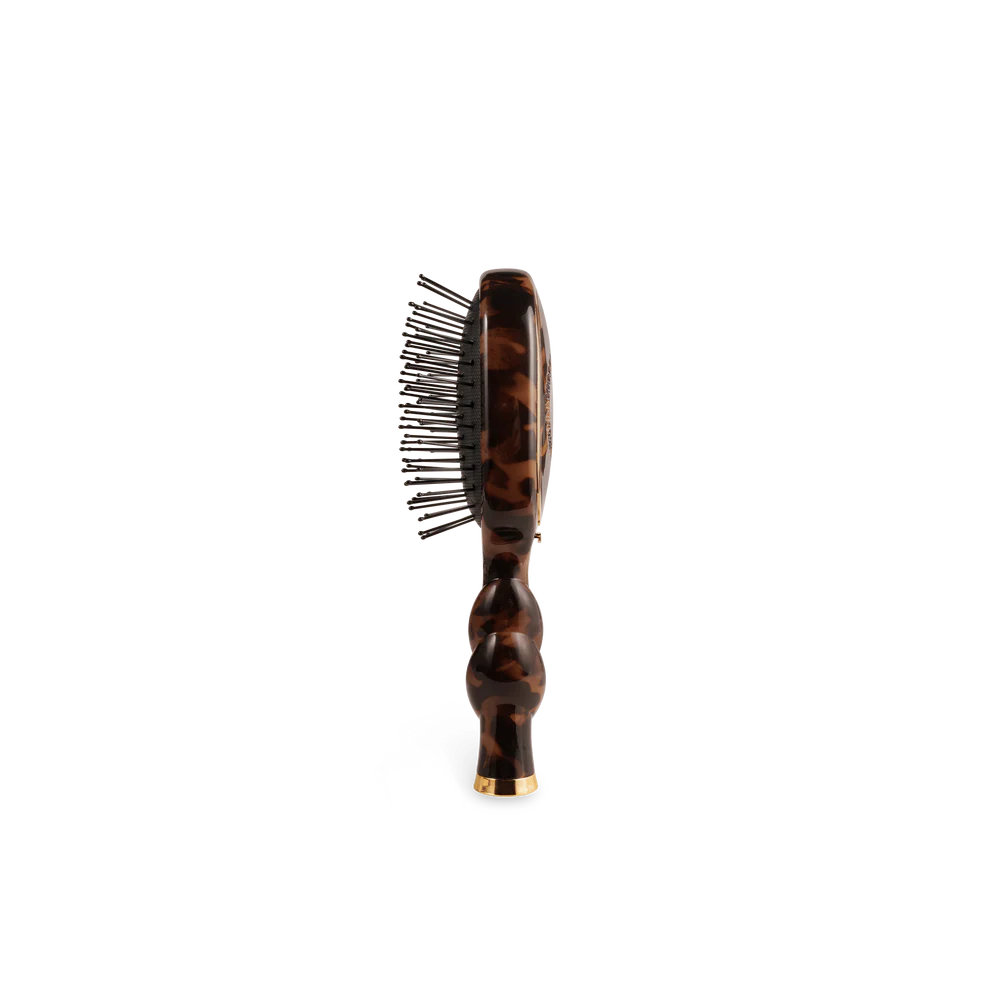 Mini Detangler Brush for Medium Hair in tortoiseshell with metal bristles and rounded handle; available in mini size.