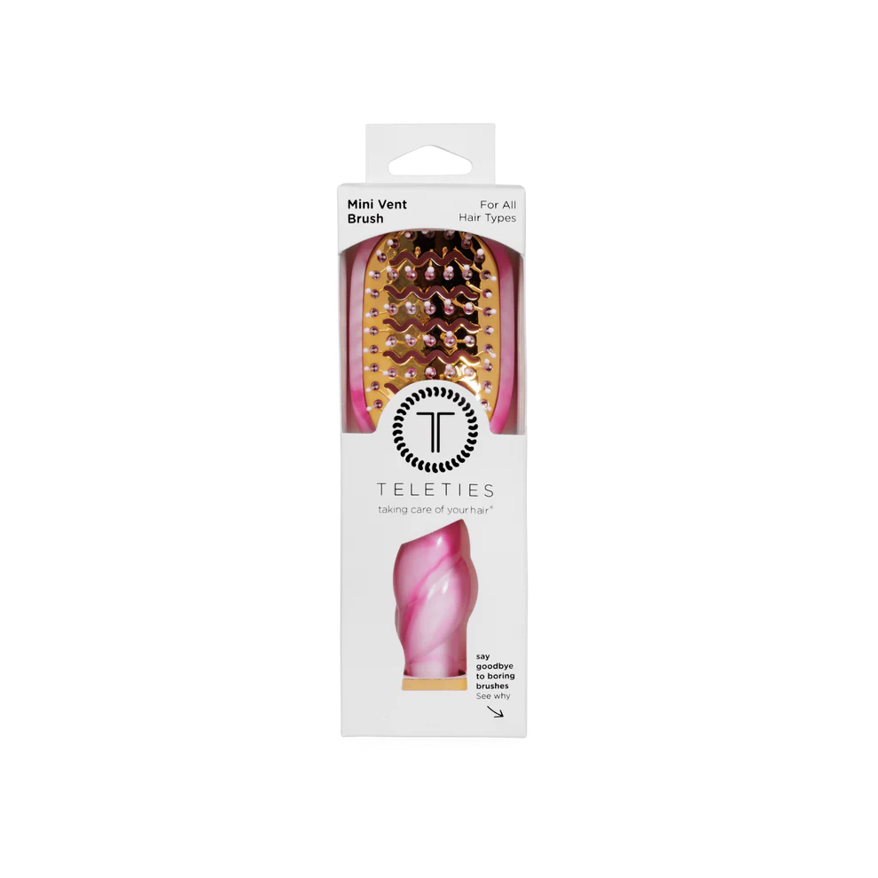Pink and gold tie-dye vented hair brush with twisted handle, available in standard size, in branded packaging.