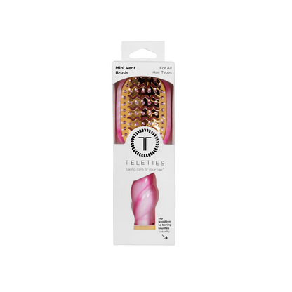 Pink and gold tie-dye vented hair brush with twisted handle, available in standard size, in branded packaging.