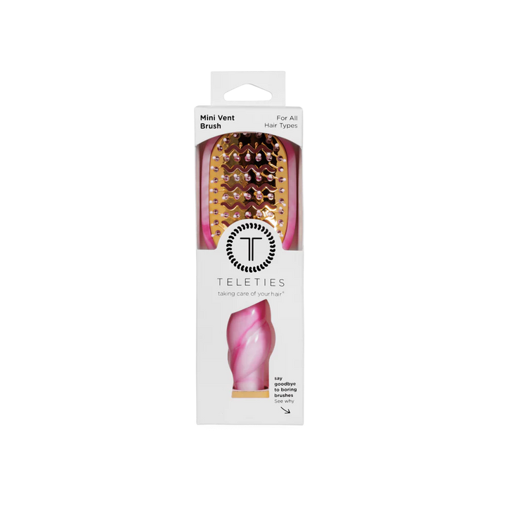 Pink and gold tie-dye vented hair brush with twisted handle, available in standard size, in branded packaging.