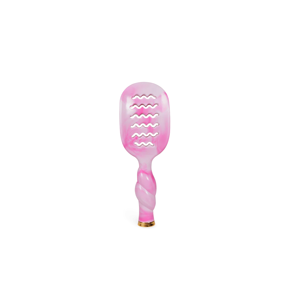 The Pinch Me! Tie Dye Pink Vented Hair Brush has a twisted handle, wavy cutouts, and a gold-tipped end. Sizes: standard.