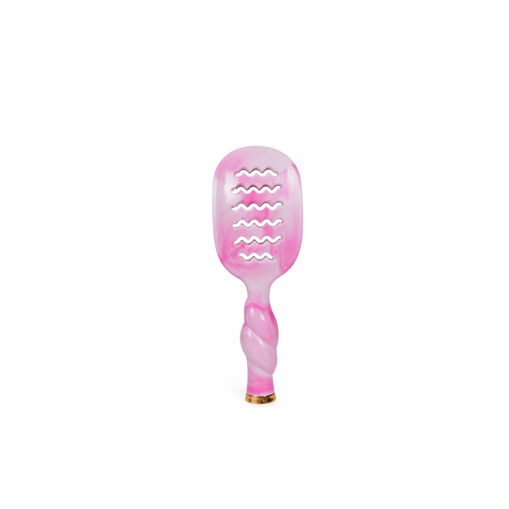 The Pinch Me! Tie Dye Pink Vented Hair Brush has a twisted handle, wavy cutouts, and a gold-tipped end. Sizes: standard.