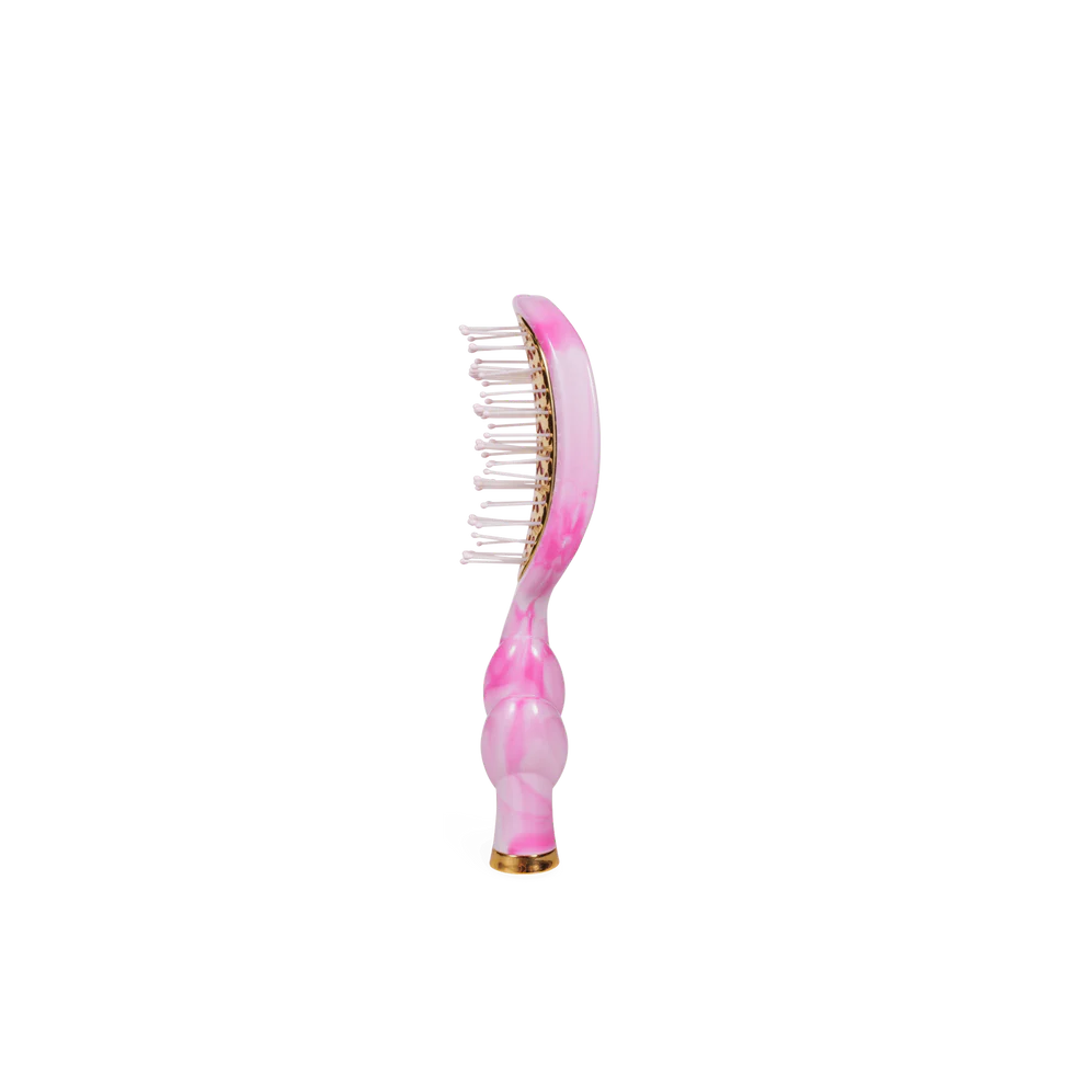 The Pinch Me! Tie Dye Pink Vented Hair Brush has wide-set bristles, a glossy pink and gold curved handle. Sizes available.