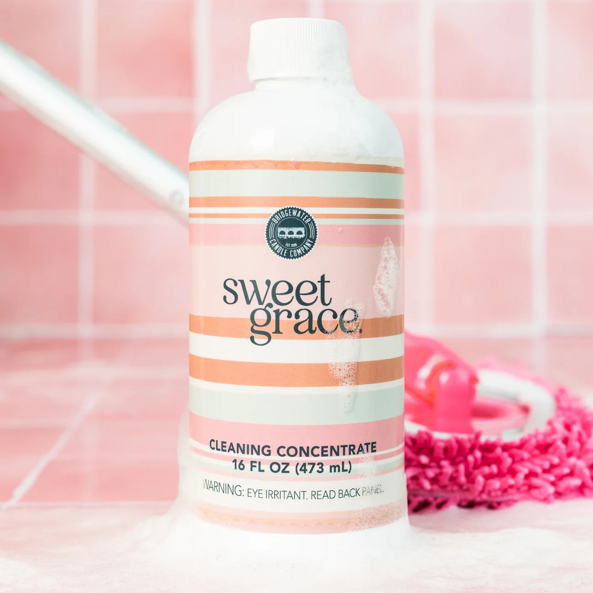 Sweet Grace Cleaning Concentrate bottle with visible foam at the base; available in multiple sizes.