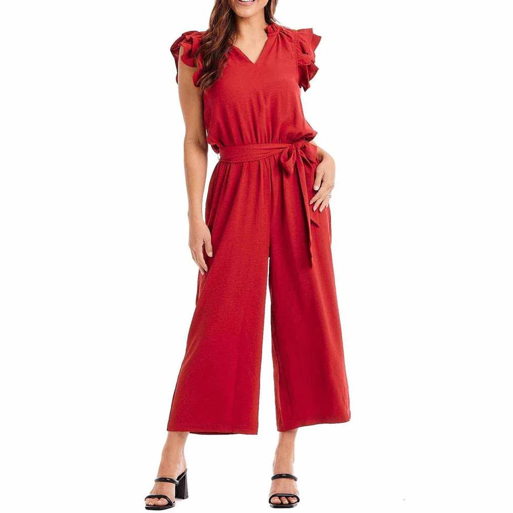 The Amethyst Jumpsuit in red features flutter sleeves, a tie waist and cropped wide-leg pants. Available sizes for this product range vary.