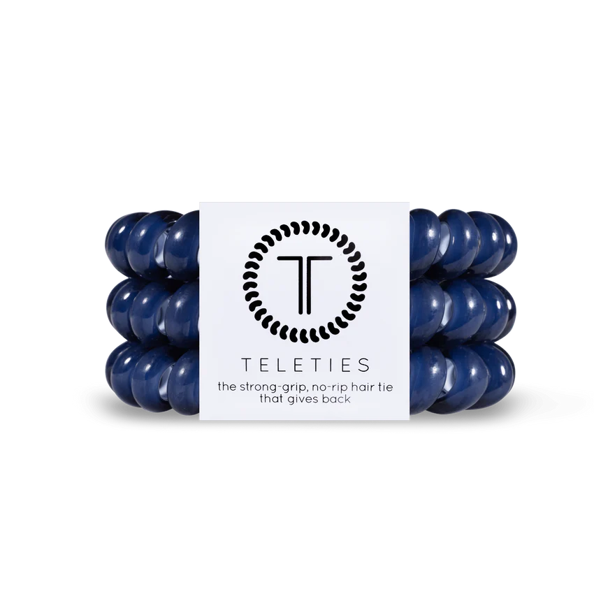 A set of dark blue TELETIES Hair Ties, known for their strong grip and no-rip feature. Available in Small (4.5 cm diameter) and Large (6.5 cm diameter).