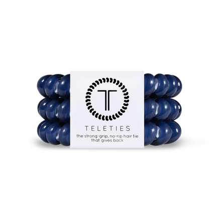 A set of dark blue TELETIES Hair Ties, known for their strong grip and no-rip feature. Available in Small (4.5 cm diameter) and Large (6.5 cm diameter).