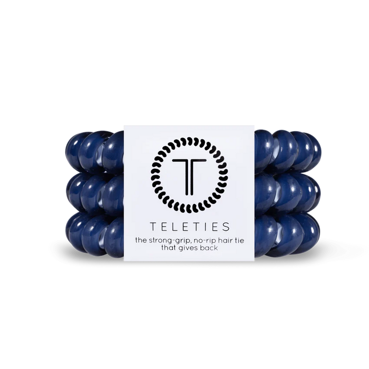 A set of dark blue TELETIES Hair Ties, known for their strong grip and no-rip feature. Available in Small (4.5 cm diameter) and Large (6.5 cm diameter).