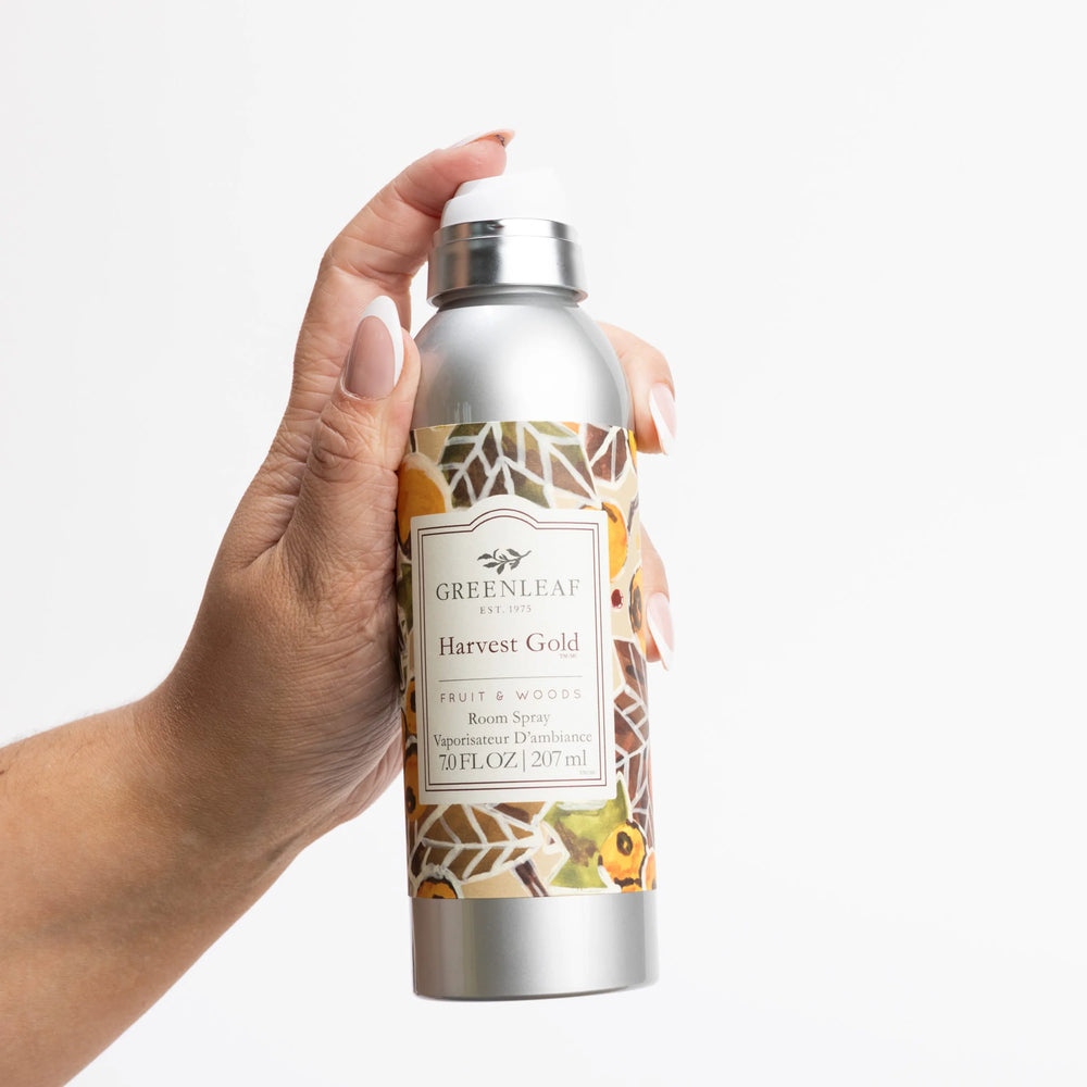 Harvest Gold Room Spray, silver can, 7.0 fl oz, floral-geometric design, long-lasting persimmon scent.