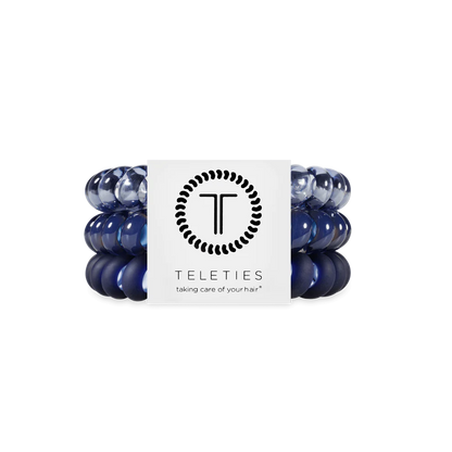 Three navy blue TELETIES hair ties on a branded card. Available in small, medium, and large sizes.