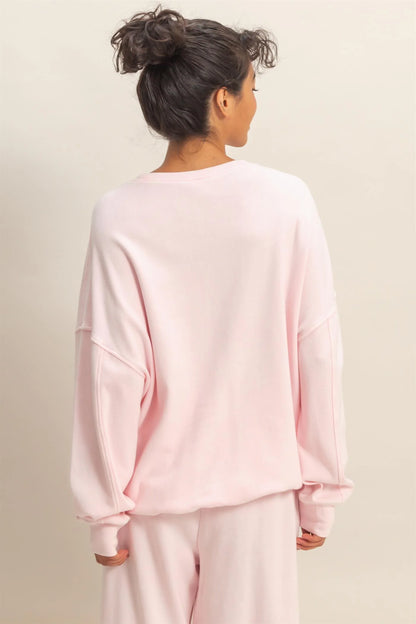 Soft Pink Acid Wash Oversized Sweatshirt. Available in sizes XS–XL.