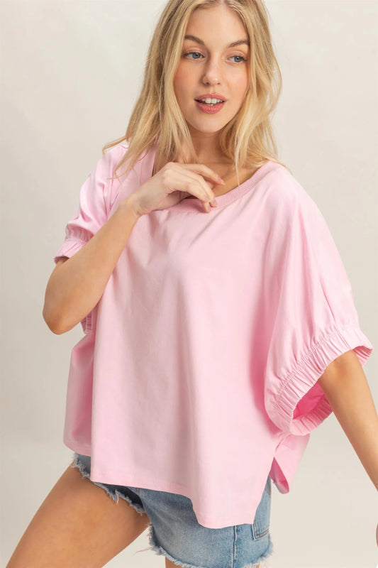 Light Pink Oversized Elastic Cuff Top with loose fit and stretch cuffs. Available in sizes XS-XL.