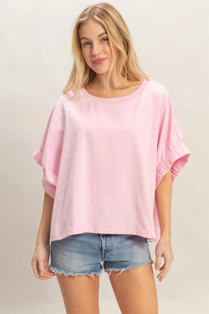 Light Pink Oversized Elastic Cuff Top with relaxed fit. Available in sizes XS–XL.