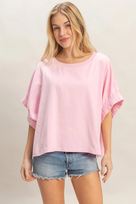 Light Pink Oversized Elastic Cuff Top with relaxed fit. Available in sizes XS–XL.