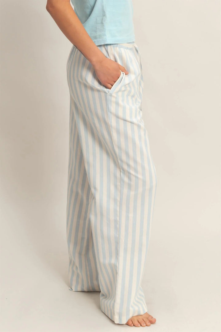 Blue vertical striped elastic pants with pockets, light blue and white stripes. Available in sizes S-XL.