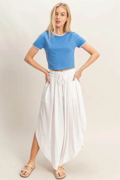 White Tulip Hem Wide-Leg Pants, available in sizes XS-XL.