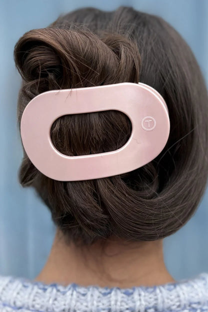 The TELETIES Flat Round Hair Clip features an elegant large pink design with an oval cutout, perfect for securing styled hair. Available in one size.