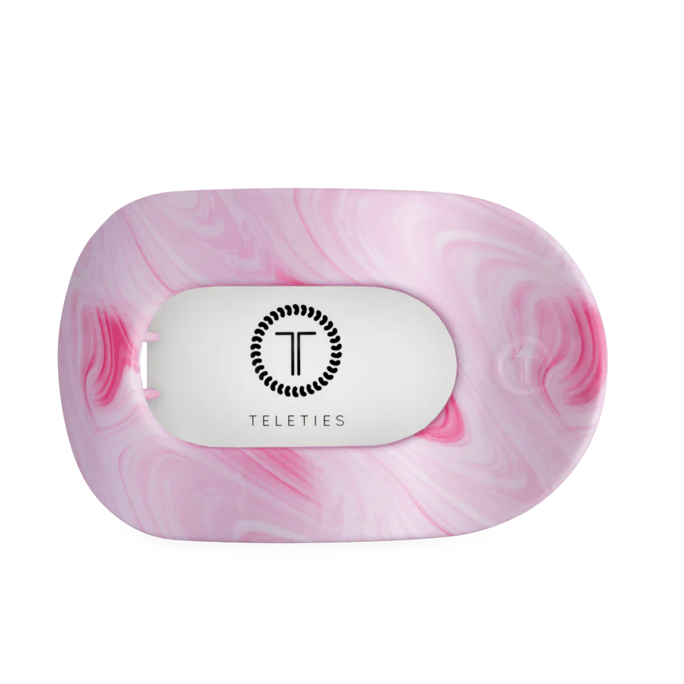 Pink and white marbled oval hair clip with central white section, black Teleties logo. Available in multiple sizes.