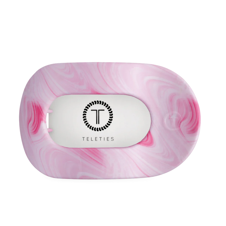 Pink and white marbled oval hair clip with central white section, black Teleties logo. Available in multiple sizes.