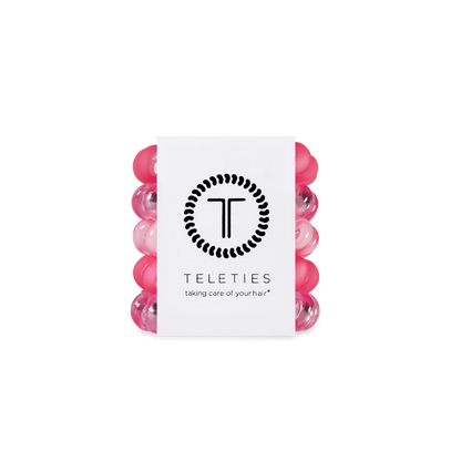 Set of five pink and clear TELETIES hair ties with branded card; available in small, medium, and large sizes.