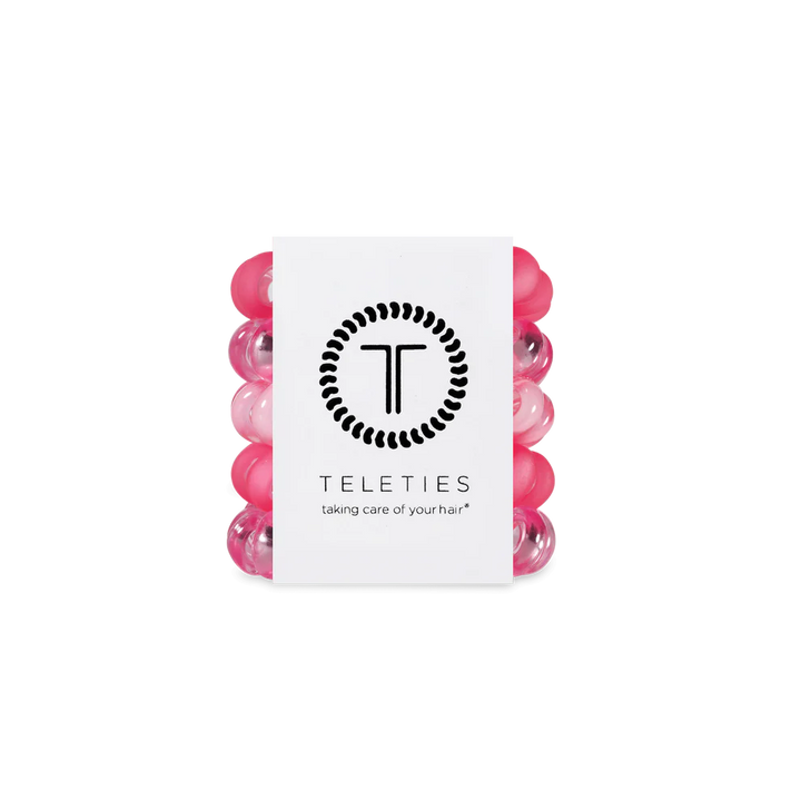 Set of five pink and clear TELETIES hair ties with branded card; available in small, medium, and large sizes.