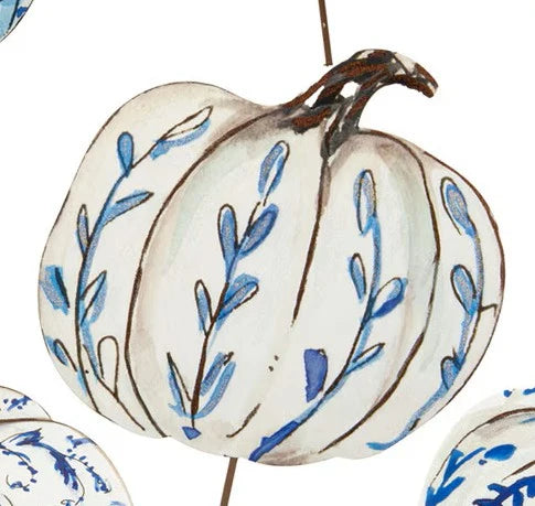 Beck’s Blue &amp; White Pumpkin: a white decorative pumpkin with blue painted floral vines and a brown stem.