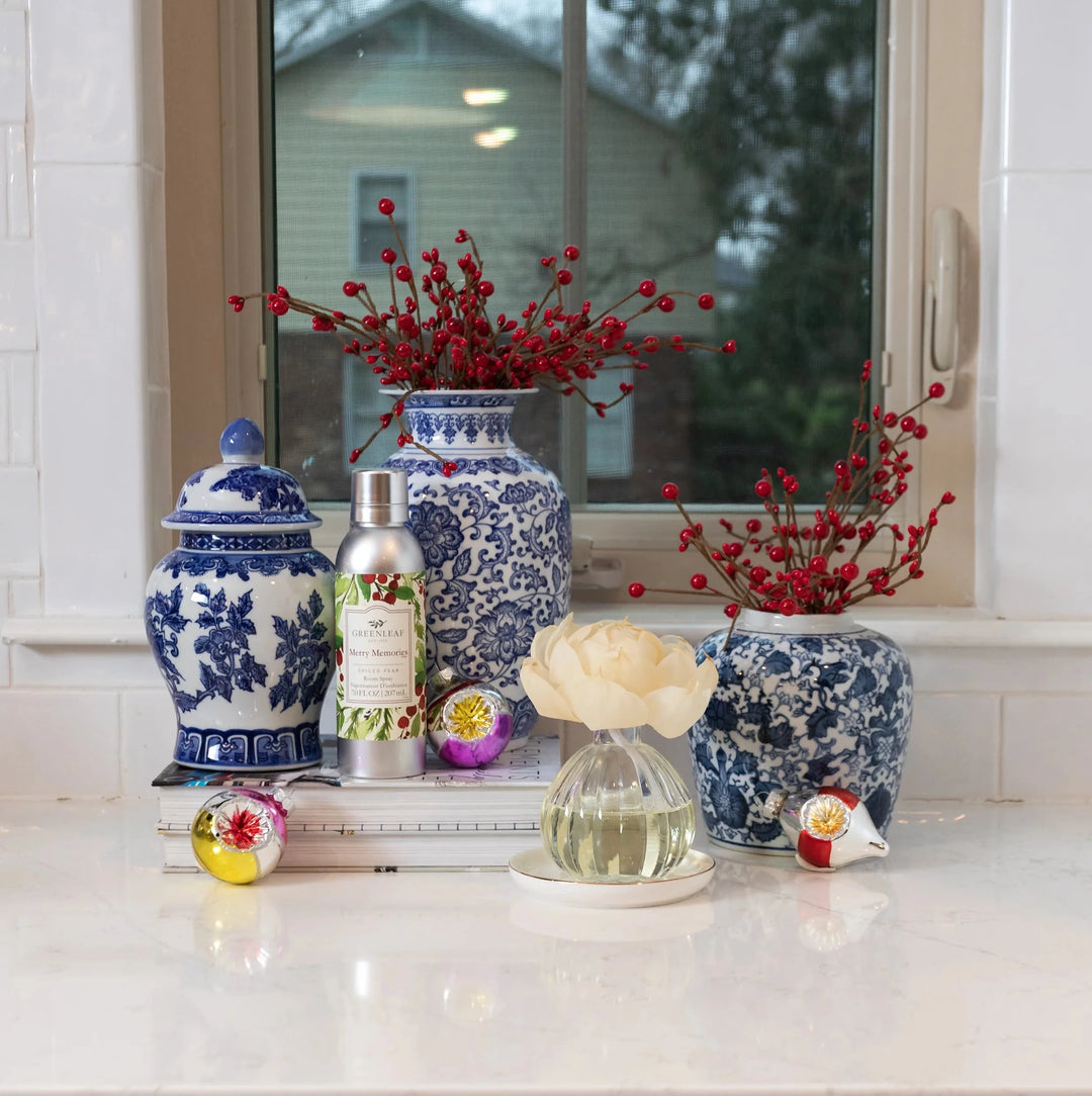Merry Memories Room Spray in a silver bottle with a festive berry and leaf label, 4.0 fl oz (118 ml).