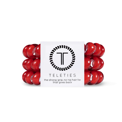 A package of red TELETIES Hair Ties features strong-grip, no-rip accessories. Available sizes: Small, Large.