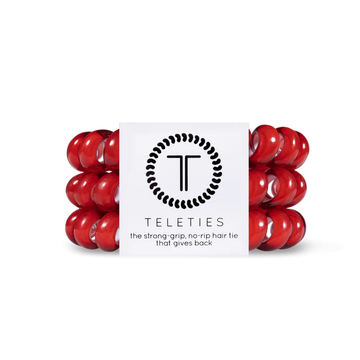 A package of red TELETIES Hair Ties features strong-grip, no-rip accessories. Available sizes: Small, Large.