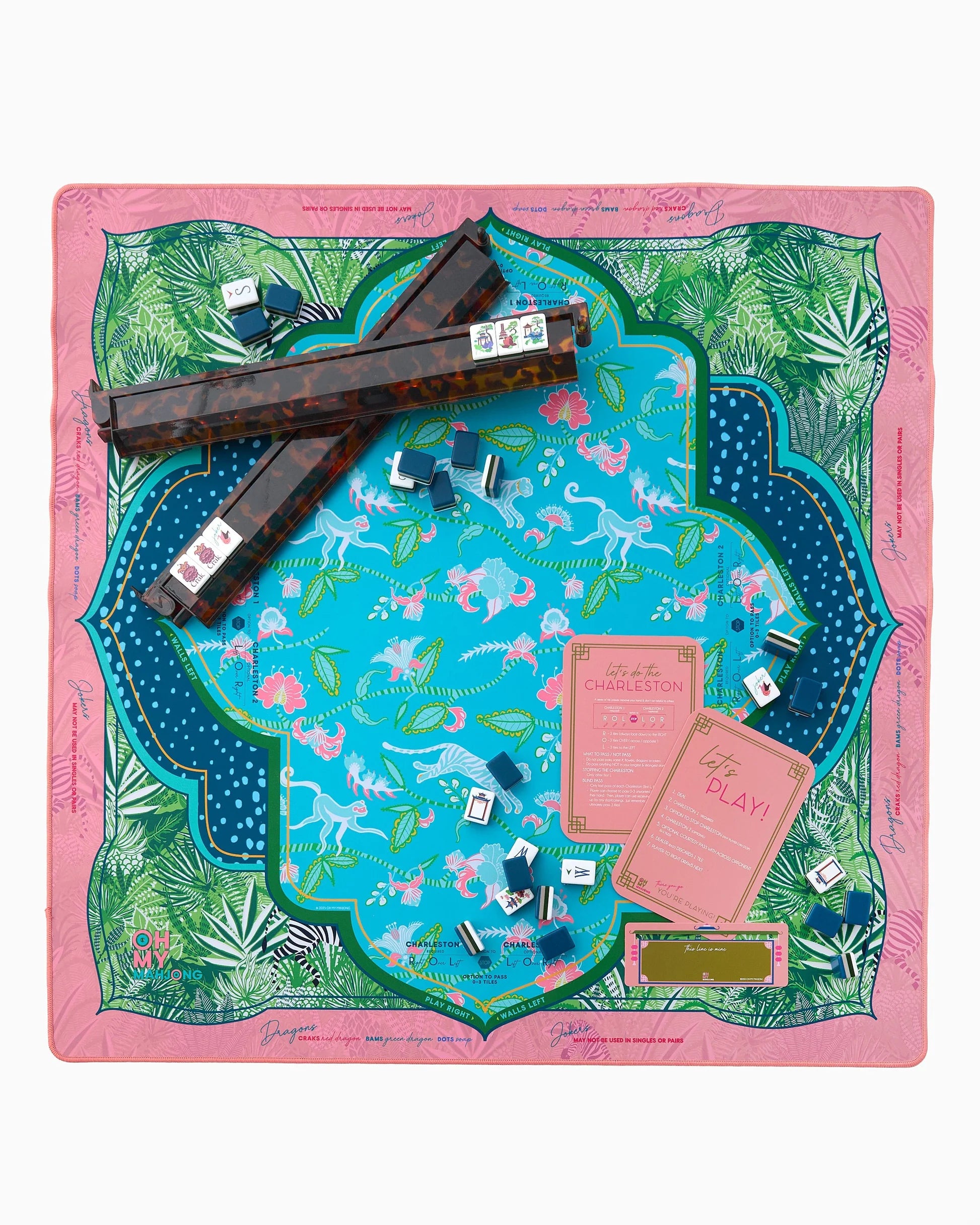 Pink and blue Serengeti Mat in Tube with tropical leaves and tigers. Available sizes: standard, large.