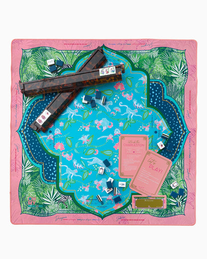 Pink and blue Serengeti Mat in Tube with tropical leaves and tigers. Available sizes: standard, large.