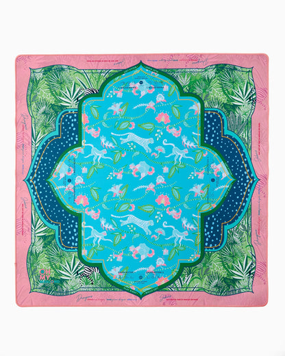The Serengeti Mat in Tube features pink borders, green leaves, leopards, and birds. Available in small and large sizes.