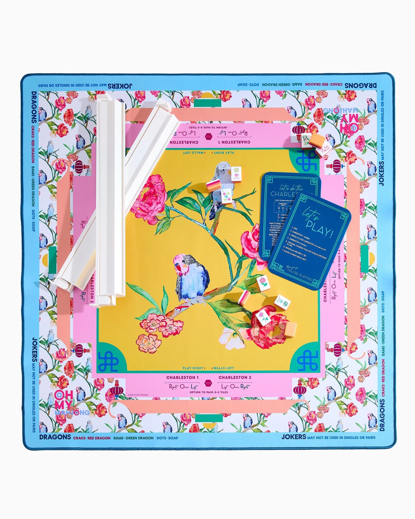 Spring Fling x Brooke Wright Mat: vibrant floral and bird motifs, labeled for dragons, jokers, flowers. Available in multiple sizes.