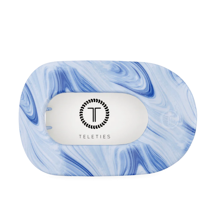 Flat Round Hair Clip in blue and white tie-dye, rectangular shape, TELETIES logo on white center. Available in multiple sizes.