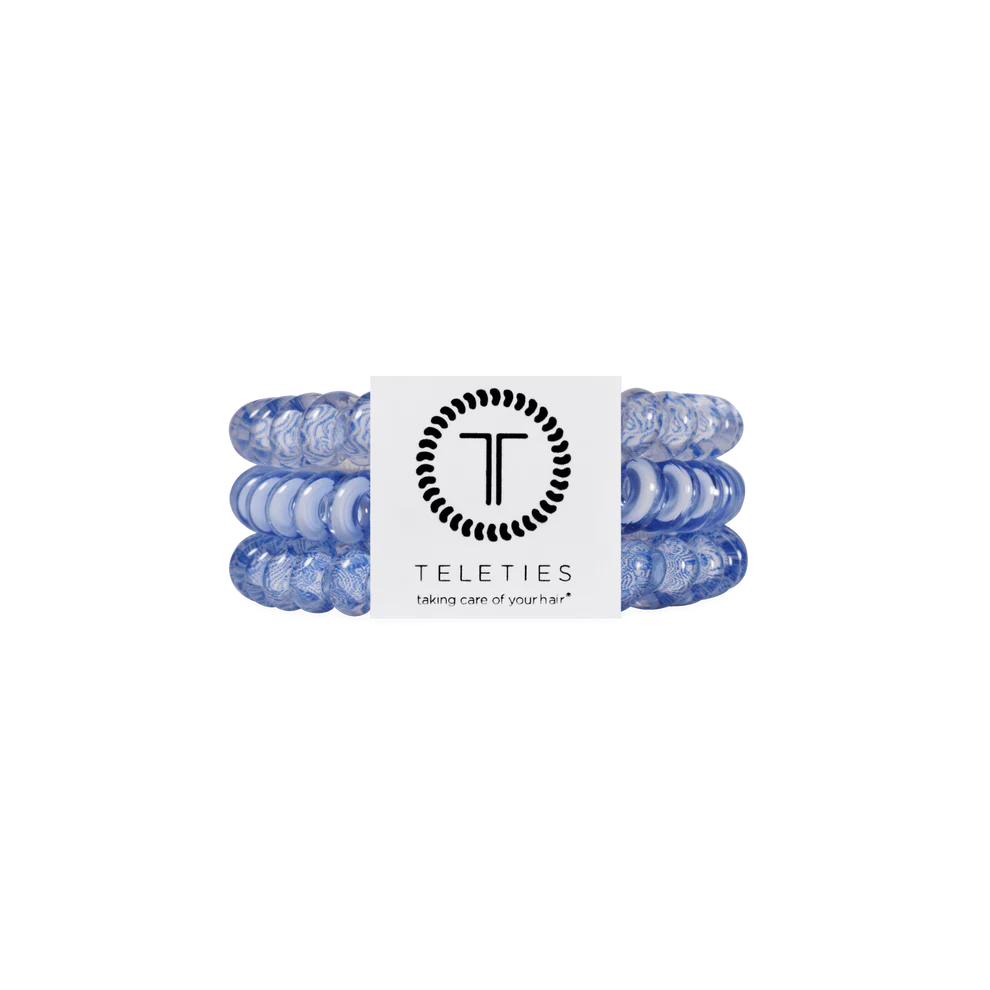Three light blue TELETIES Hair Ties stacked with branded white label. Available in small, medium, and large sizes.