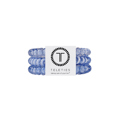 Three light blue TELETIES Hair Ties stacked with branded white label. Available in small, medium, and large sizes.