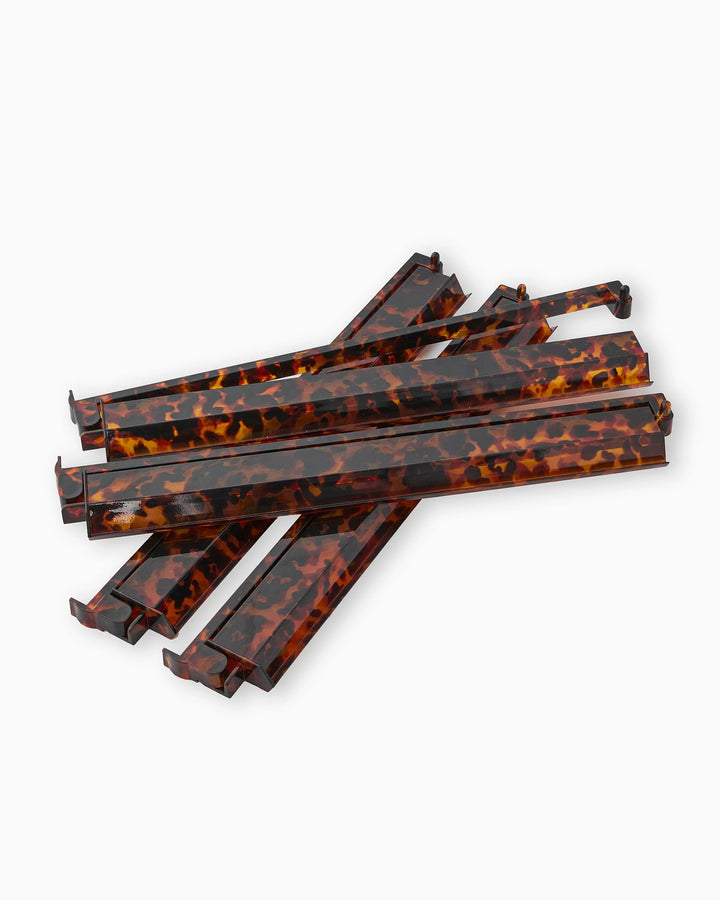 Five tortoiseshell-patterned, rectangular eyeglass arms with hooked ends. Available in small, medium, and large sizes.