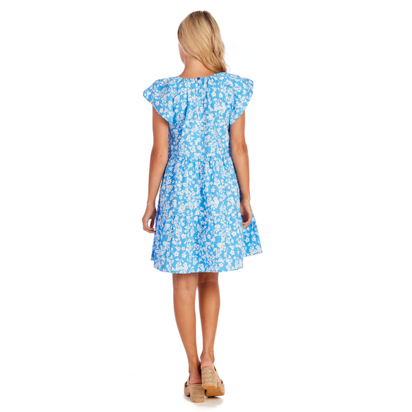 The product is a Blue Ditsy Floral Rachel Tiered Dress. It is available in the following sizes: Small, Medium, Large, and Extra-Large. The dress features a tiered design with a blue ditsy floral print.