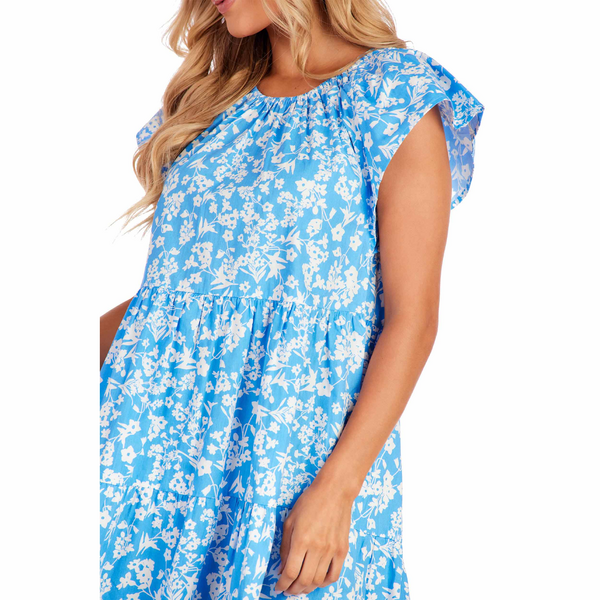 This Blue Ditsy Floral Rachel Tiered Dress features ruffle sleeves. Sizes available range from small to extra large.