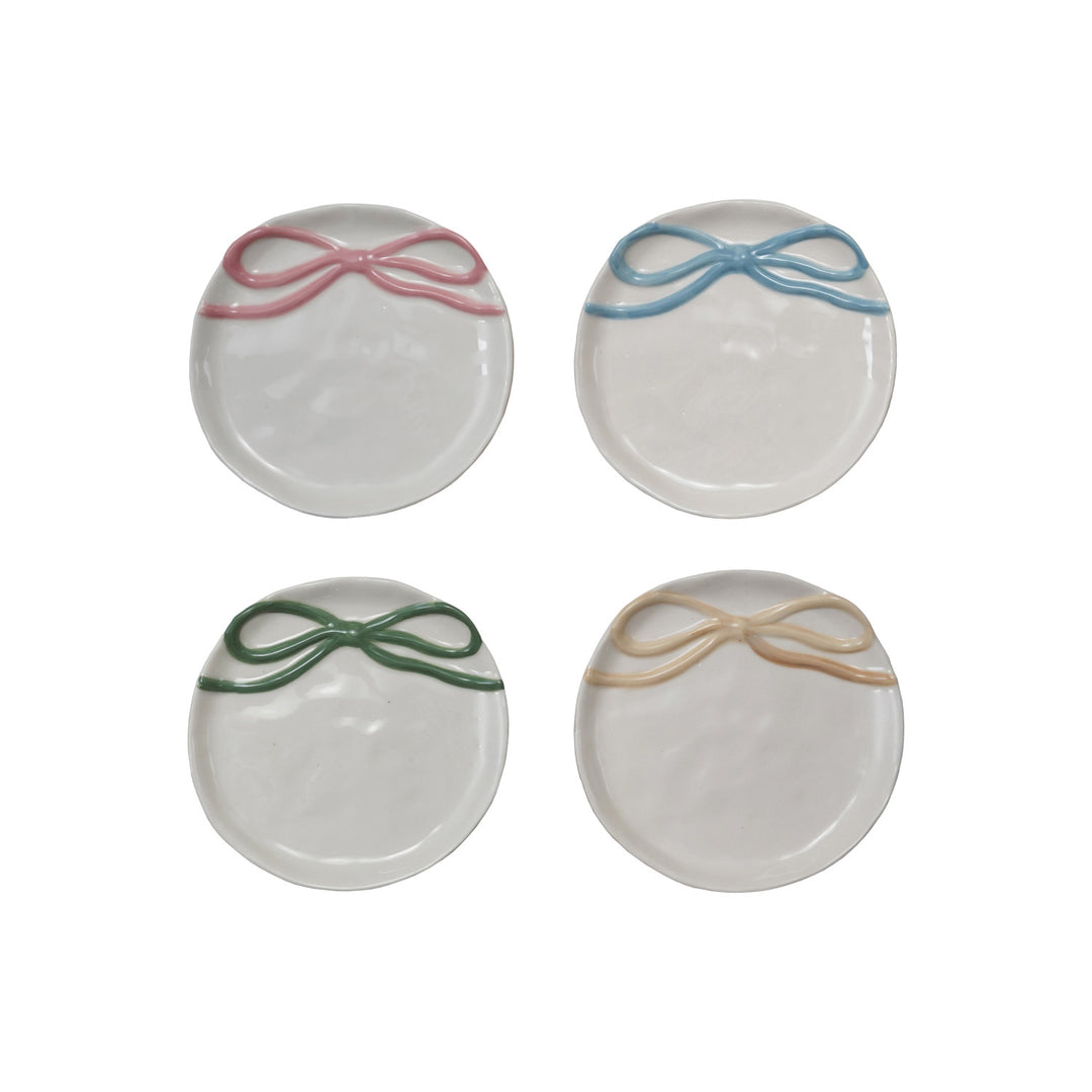 Set of four round stoneware dishes with bow in pink, blue, green, yellow. Available in 6" and 8" sizes.