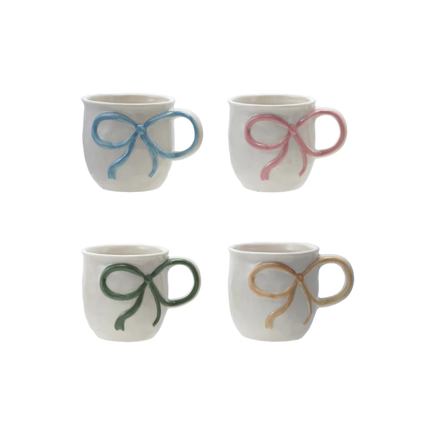 Set of four 18 oz. stoneware mugs with bow handles in blue, pink, green, and yellow.