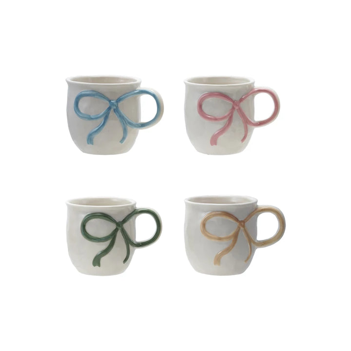Set of four 18 oz. stoneware mugs with bow handles in blue, pink, green, and yellow.