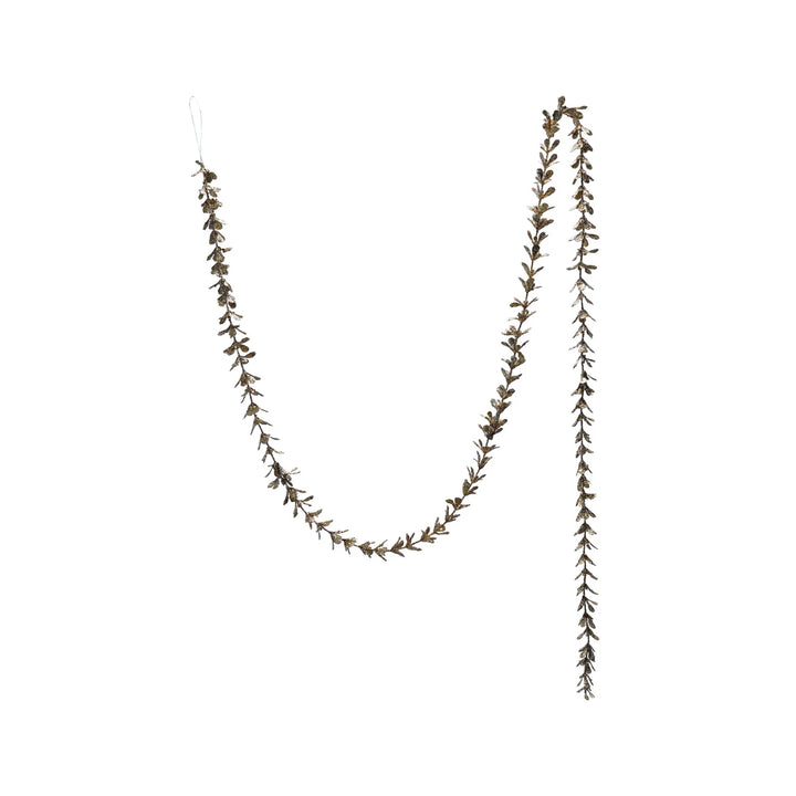 72″L x 1″H Faux Boxwood Garland with Glitter in champagne finish.