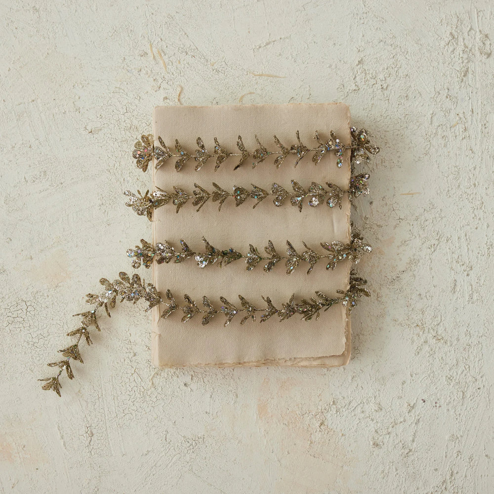 72″L x 1″H Faux Boxwood Garland with Glitter in Champagne.