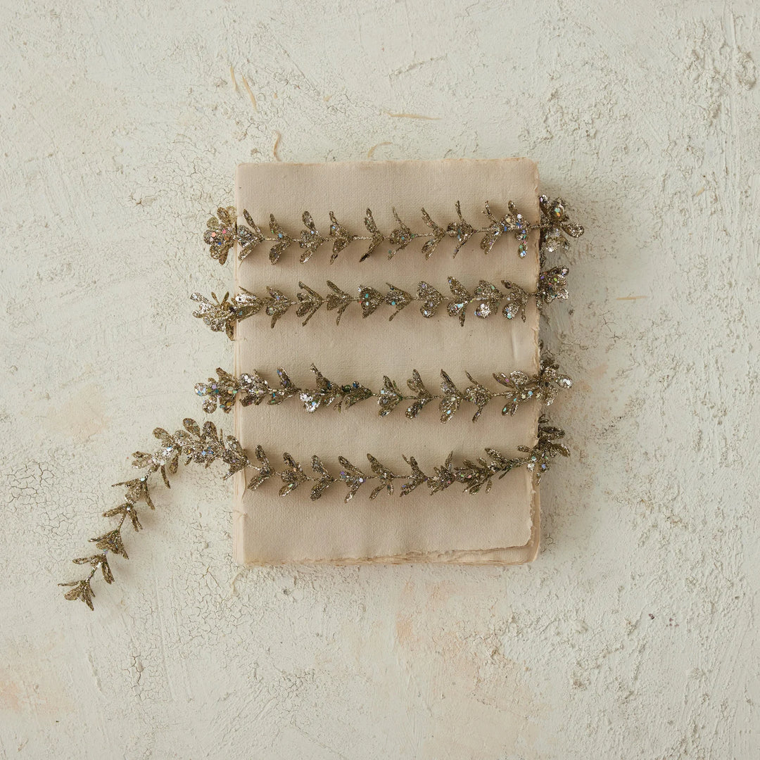 72″L x 1″H Faux Boxwood Garland with Glitter in Champagne.