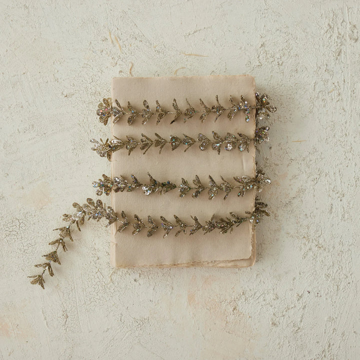 72″L x 1″H Faux Boxwood Garland with Glitter in Champagne.